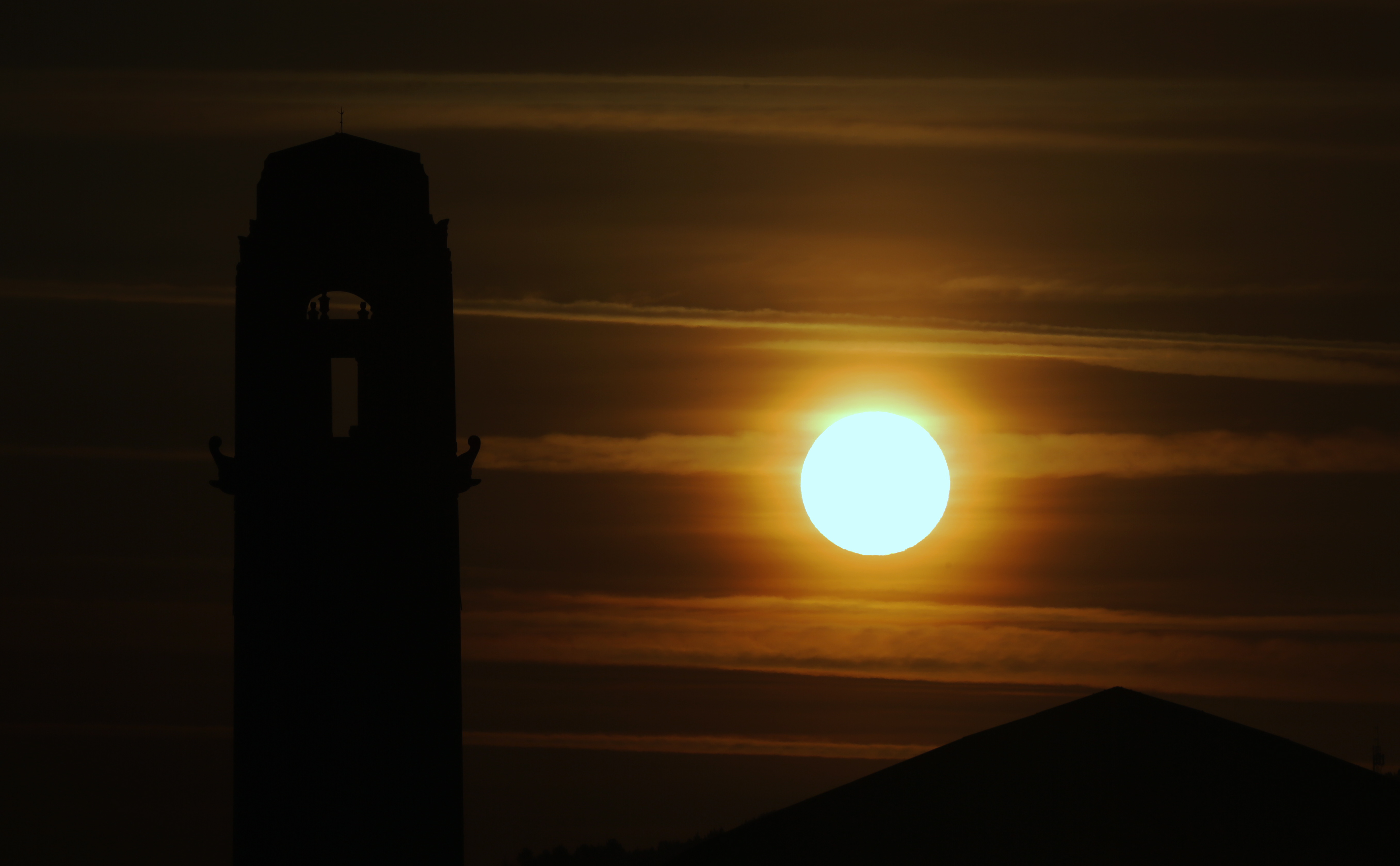 Pictured: The sun rises over the clock tower of the Guild Hall in Swansea, south Wales, UK. Wednesday 21 June 2017 Re: Summer Solstice
