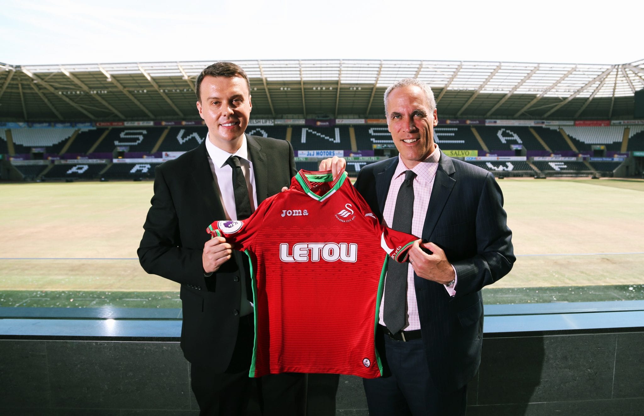 Pictured L-R: Paul Fox, CEO of Letou with Chris Pearlman, COO of Swansea City FC. Monday 19 June 2017 Re: Swansea City FC launch their new home and away kits and announce Letou as their new sponsor at the Liberty Stadium, Swansea, Wales, UK.