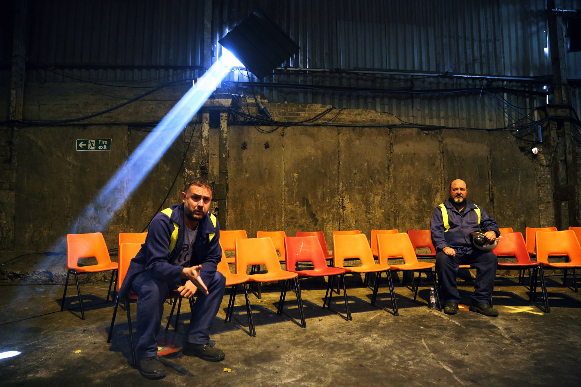 Pictured: Actors Simon Nehan and Sion Tudor Owen Re: Press rehearsal of "We'Re Still Here", a play created by Rachel Trezise, Common Wealth and the National Theatre Wales about steelworkers, which will be performed in Byass Works, a disused industrial unit, in Port Talbot, south Wales, UK.