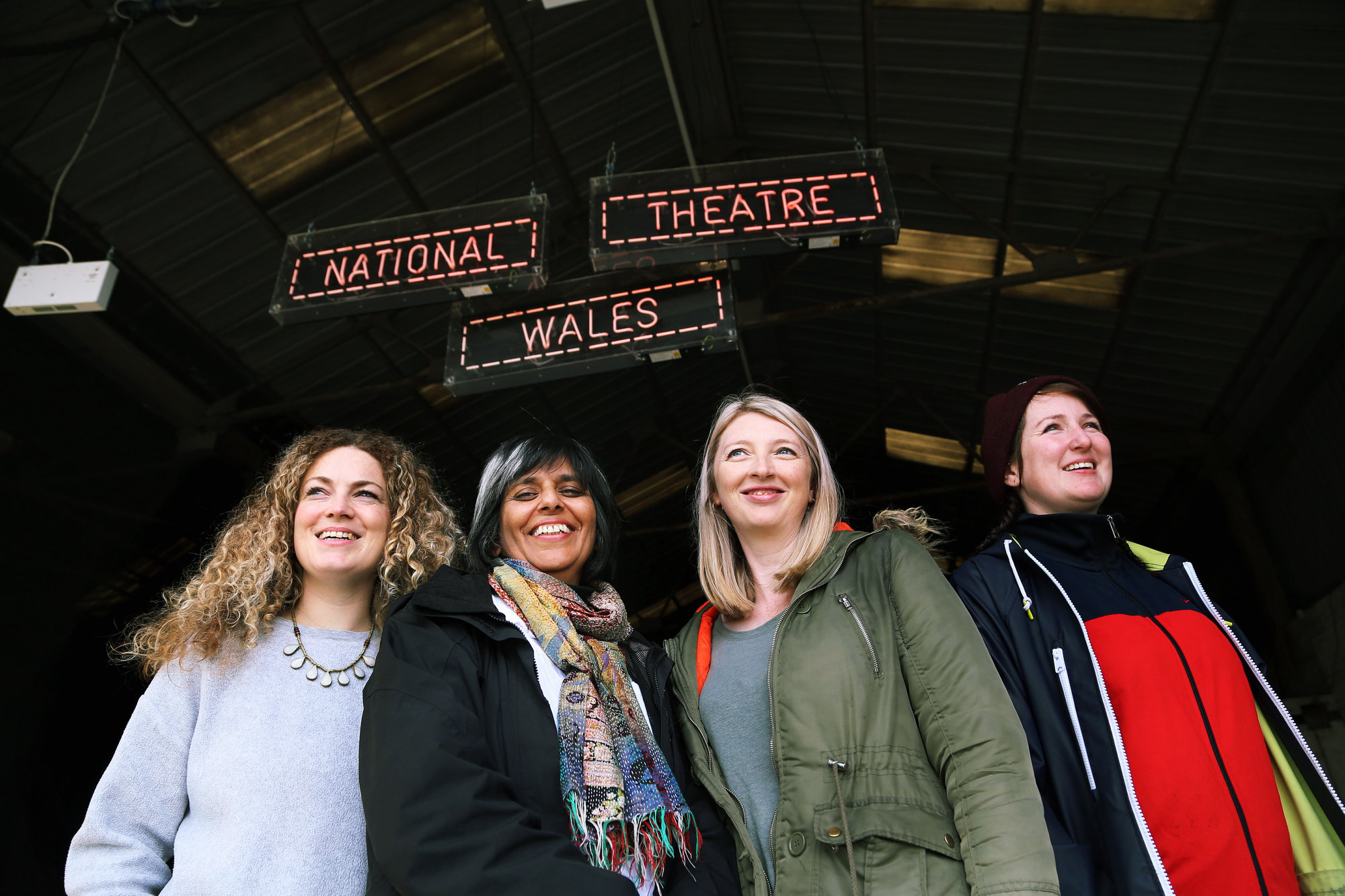 Pictured L-R: Co-director Evie Manning, artistic director Kully Thiarai, writer Rachel Trezise and co-director Rhiannon White Re: Press rehearsal of "We'Re Still Here", a play created by Rachel Trezise, Common Wealth and the National Theatre Wales about steelworkers, which will be performed in Byass Works, a disused industrial unit, in Port Talbot, south Wales, UK.