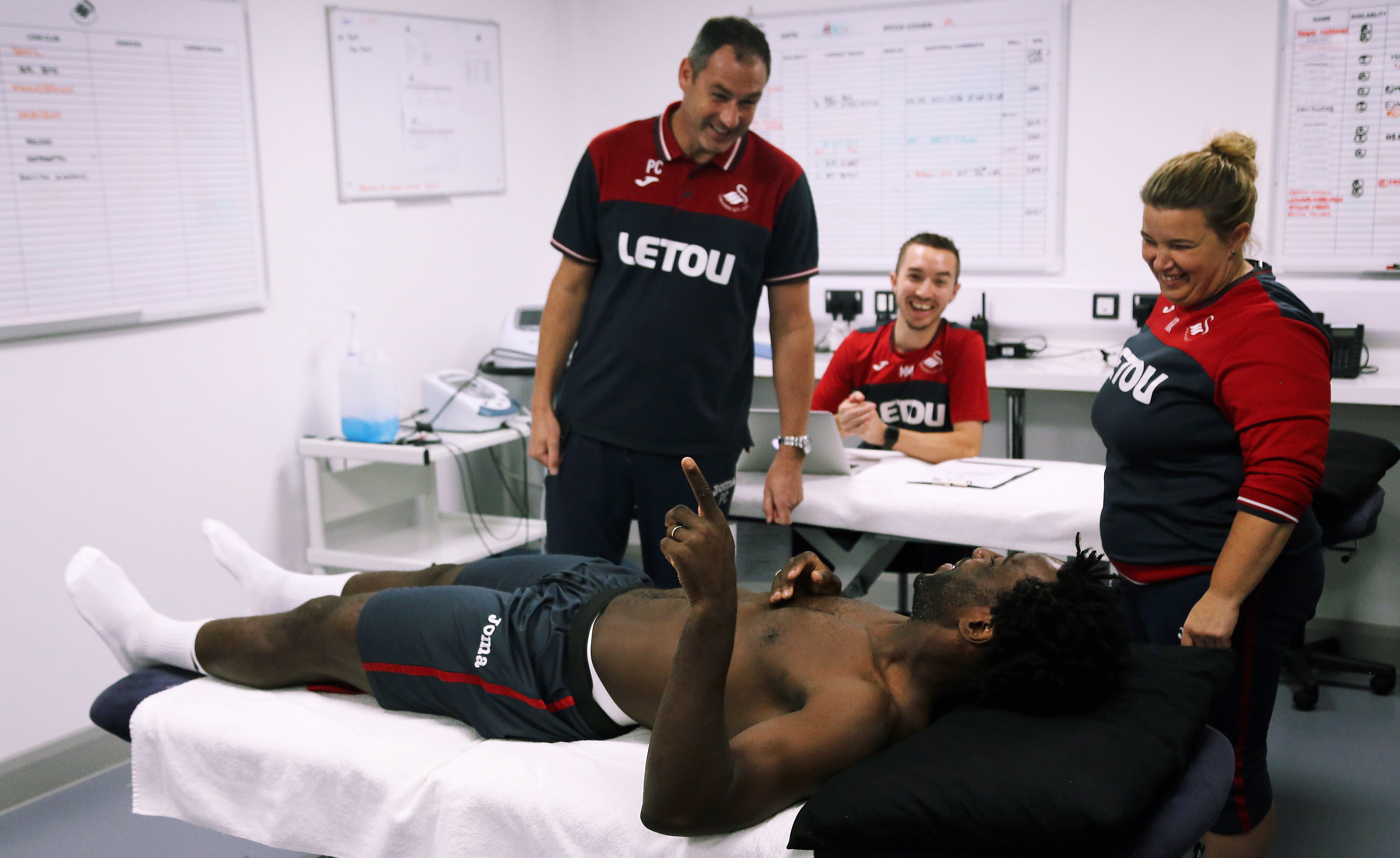 Pictured: Wilfried Bony speaks with manager Paul Clement during his medical with club physiotherapist Kate Rees at the Fairwood Training Ground, Wales, UK. Thursday 31 August 2017 Re: Wilfried Bony has signed a contract with Swansea City FC.