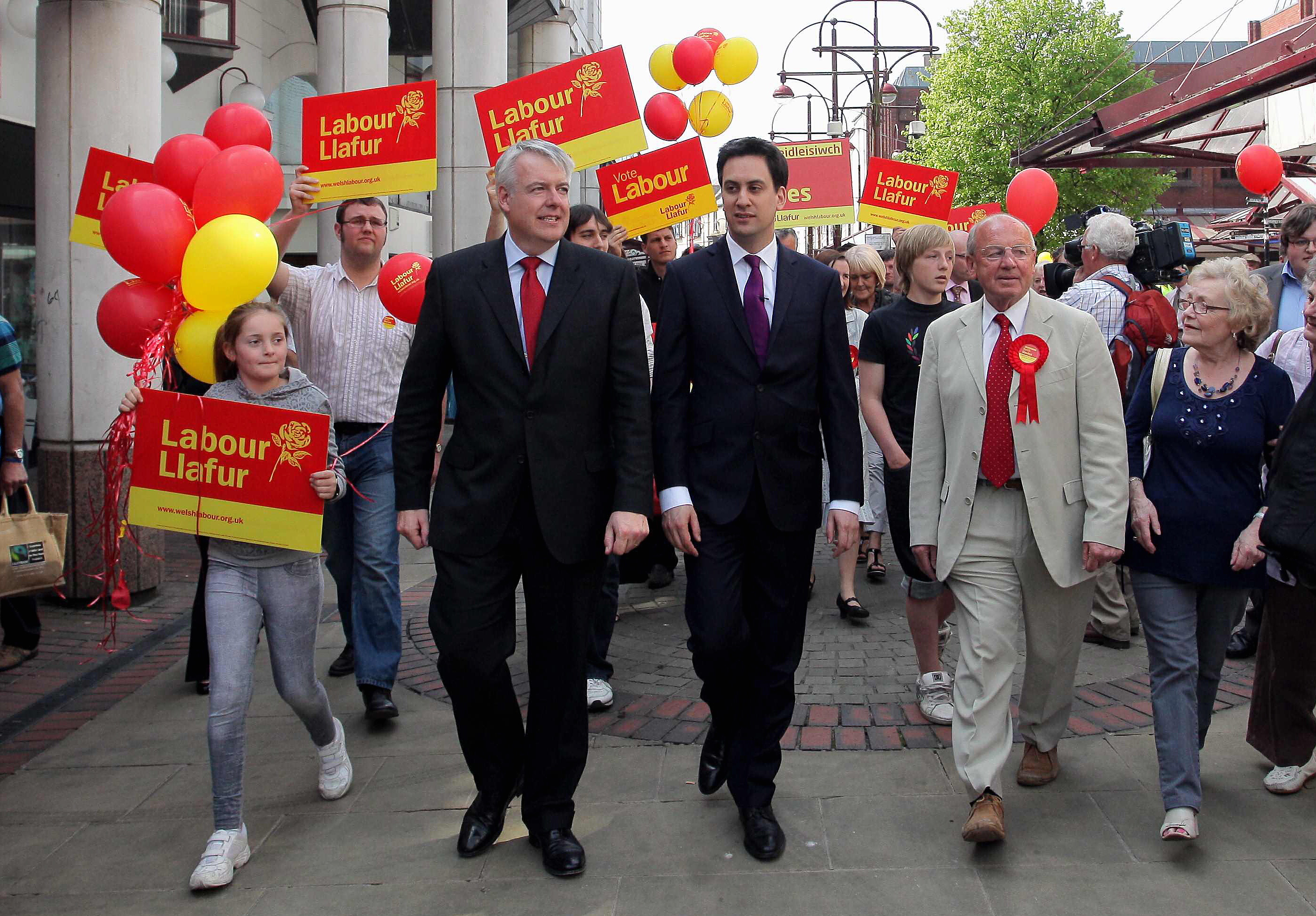 Pictured: Labour leader Ed Miliband (C) strolls through Llanelli town centre with First Minister for Wales Carwyn Jones (L) and Welsh Assembly candidate for Llanelli Keith Davies (R). Wednesday 20 April 2011 Re: Labour Party leader Ed Miliband was touring south and west Wales today in support to candidates of the forthcoming Welsh Assembly election in May. He arrived by train to Swansea Railway Station where he was greeted by MP for Neath Peter Hain and he was then driven to Llanelli, Carmarthenshire where he toured in the city's enclosed market with local Labour candidate.