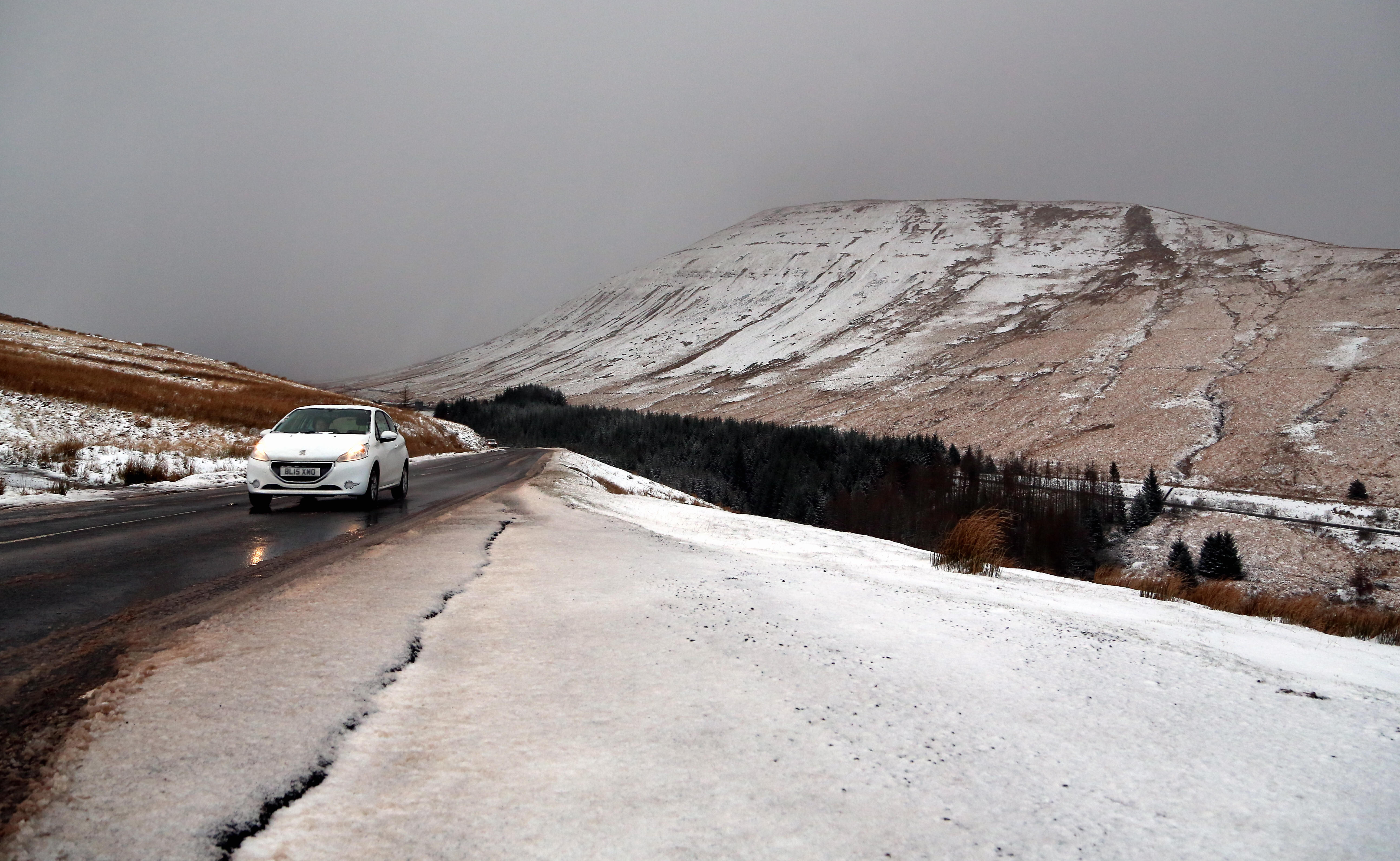 WEATHER PICTURE WALES Pictured: A car travels on the A4059 in the Brecon Beacons, south Wales, UK. Friday 08 December 2017 Re: Snow and ice has been forecast for parts of the UK.